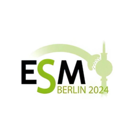 The image is a logo for 'ESM Berlin 2024'. The design features a stylized representation of the Berlin skyline with a prominent image of the Fernsehturm (Television Tower), a well-known landmark. The skyline is encapsulated within a curved line that resembles a track, perhaps indicating movement or a sporting event. The letters 'ESM' are in bold, with 'BERLIN 2024' underneath in a smaller font. The colour scheme is a mix of green shades, black, and white, giving it a clean, modern look. The overall impression is that of a logo related to a significant event, possibly sports or a conference, scheduled to take place in Berlin in the year 2024.