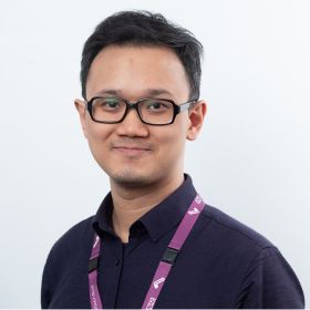Dr Ta-Wei Guu - DEMENTIA RESEARCHER Portrait of a man with short black hair and glasses, wearing a dark blue shirt and pink lanyard, smiling at the camera?